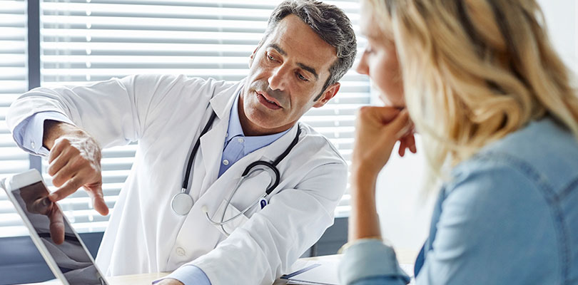 A doctor is explaining a diagnosis to a patient