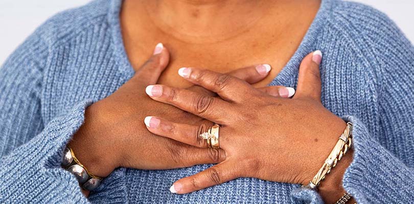 A woman is experiencing chest pain